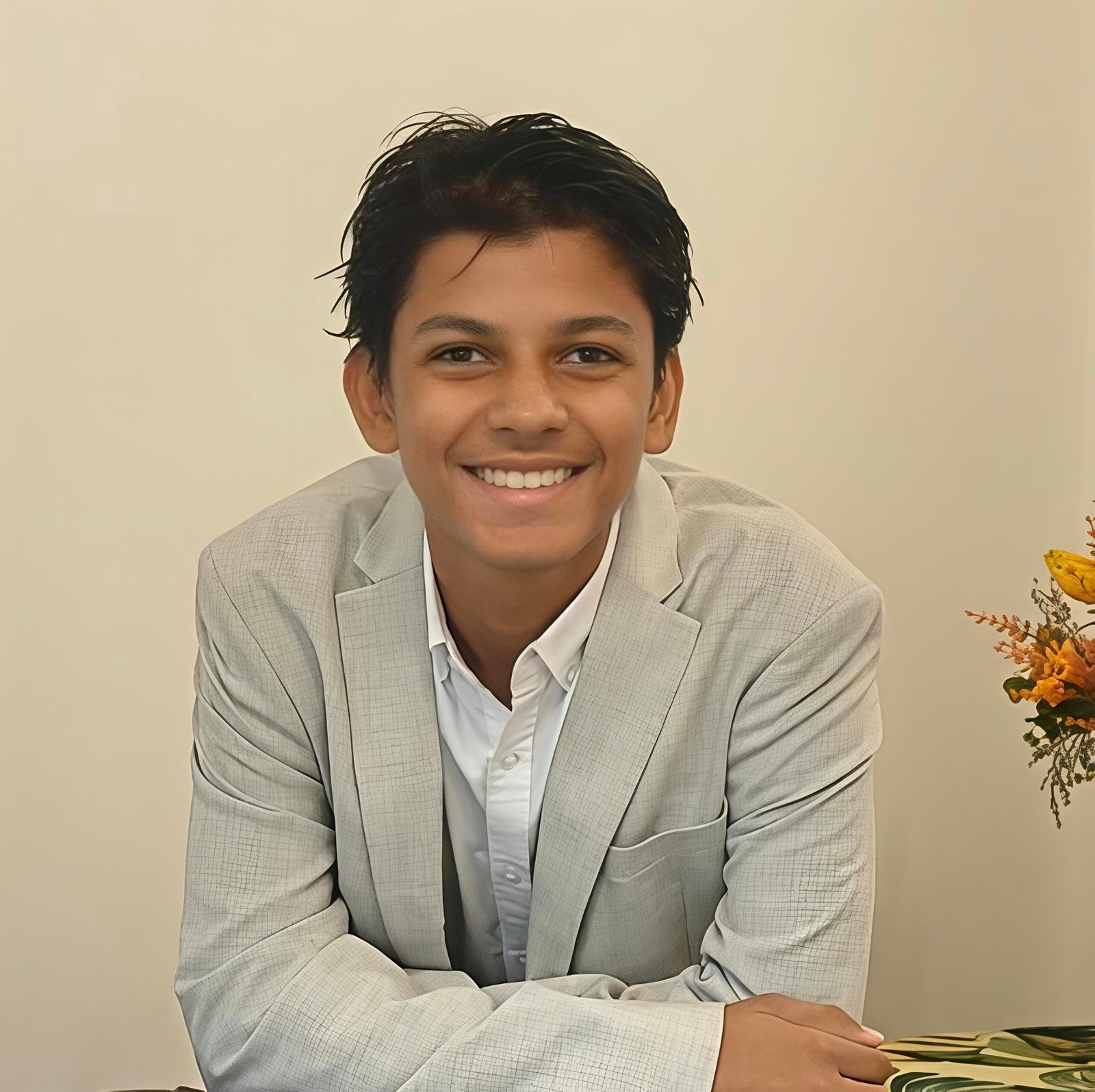 Aarush Choubey smiling in a light suit